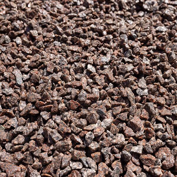 Close-up of crushed red granite chips